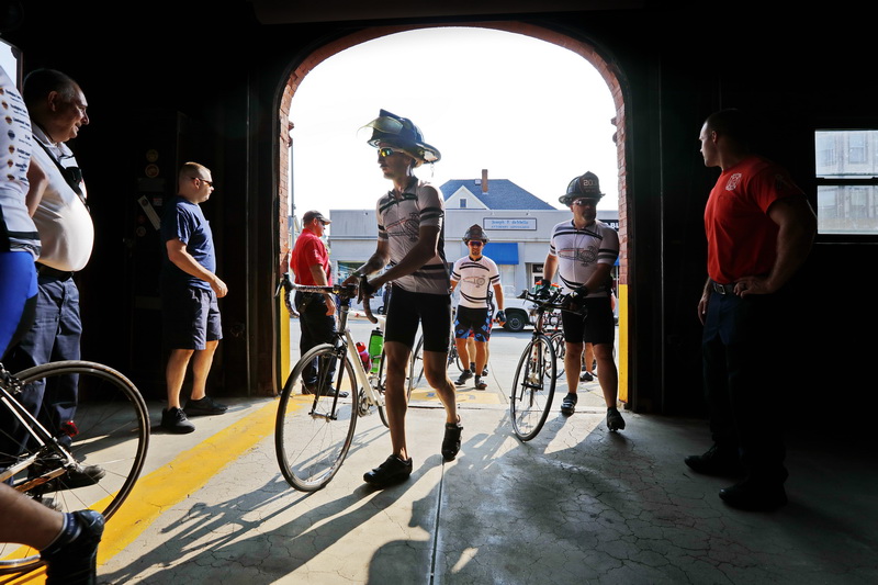 Rochester firefighter, Andy Weigel, who organized this ride, and fellow firefighters from across New England, make their way into station 8 on Acushnet Avenue as part of the Southern New England Brotherhood Ride, making a stop at in New Bedford, in remembrance of firefighter Bob Lavallee who passed away at the end of last year.  The total ride will be 275 miles stopping in various locations in Massachusetts and Rhode Island, honoring the fourteen firefighters who died in the line of duty. PHOTO PETER PEREIRA