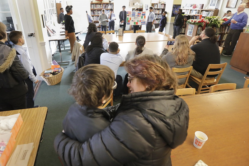 A shopper takes a closer look. as Steve Topazio of Sandtasia, carves a sand sculpture celebrating the New England Patriots Super Bowl victory, in the central section of the Dartmouth Mall.  PHOTO PETER PEREIRA