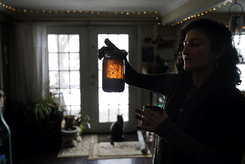 Carissa Wills-DeMello, owner of Bilo Herbs,  makes a blend of different teas at her home in Westort, MA.      PHOTO PETER PEREIRA