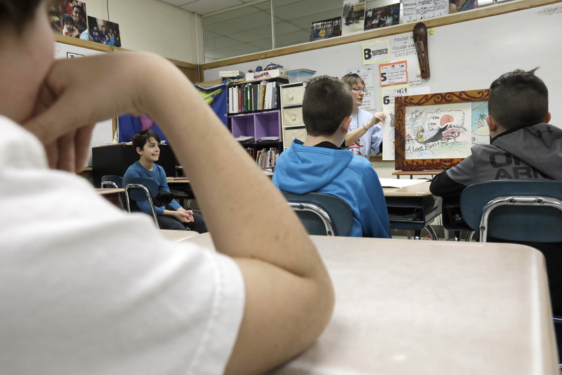 Dartmouth Middle School sixth grade social studies teacher, Carolyn Wingate, tells the story of Manjiro using a traditional Japanese Kamishibai story frame with pictures that the students made. 