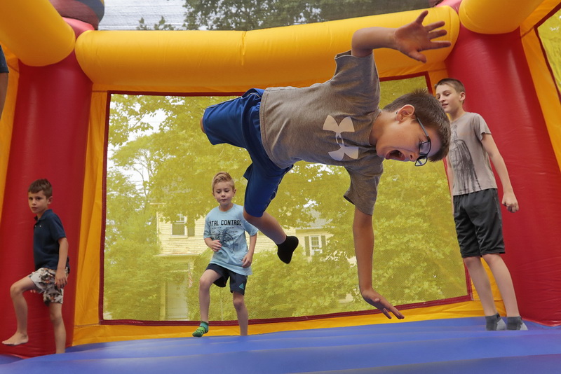 Jackson Houle, 6, finds himself suspended midair as he and other children jump inside the bounce house on Family Fun in Fairhaven, MA day as part of the Fairhaven Office of Tourism Monday Morning Fun programs which run from July to August.   PHOTO PETER PEREIRA