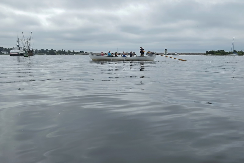 Members of the Buzzards Bay Rowing Club make their way across New Bedford harbor on a cloudy morning.   PHOTO PETER PEREIRA