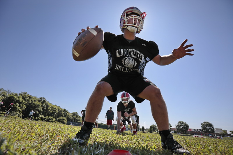 Running back Dylan DeWolfe, 18, lines up behind quarterback Noah Maxwell as Old Rochester Regional High School football team conduct their first practice of the season in Mattapoisett, MA.    PHOTO PETER PEREIRA