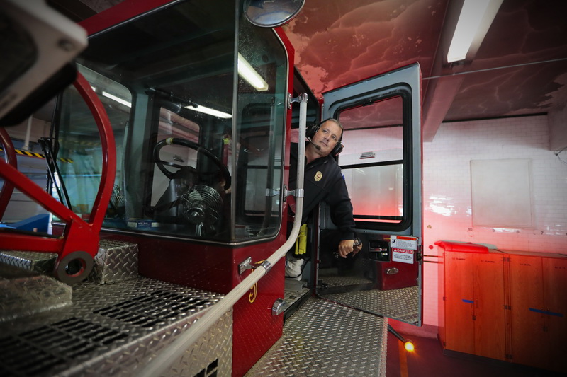 New Bedford fire chief Mike Gomes, makes his way out of Fire Department Headquarters driving the rear wheels of the Ladder 1 apparatus, which is how he started in the department 30 years ago.  Mr. Gomes retired after serving as chief for the last eight and half years, and nearly thirty years as a firefighter.  PHOTO PETER PEREIRA