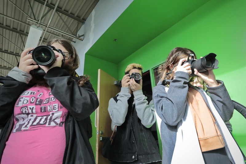 Greater New Bedford Regional Vocational Technical High School visual design and media tech students (l to r) Julia Quintin, 18, Isaiah Trinidad, 18 and Elizabeth Santos, 16, use cameras to document the current state of the Boys and Girls Club of New Bedford, before creating a remodeling plan, as part of an initiative by Project Connect which links individuals/schools with corporations for community development.  