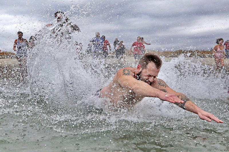 James O'Driscoll, brother of Shannon, dives into the cold waters off of Goosebury Island in Westport, MA, for the annual Plunge of the Faithful in celebrating the life of Shannon O'Driscoll who was killed in 2006 by an SUV driver while holding a sign supporting organized day care programs in the state. This is part of a fundraiser, which has raised over 20K dollars since it began.   