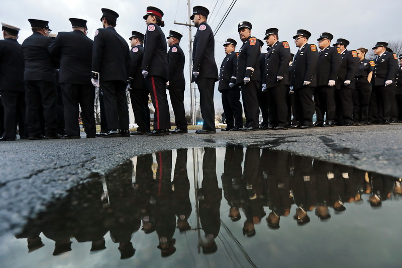 Firefighters from across two states line up outside of the Hathaway Community Home for Funerals in Somerset, MA for the wake of Somerset Fire Chief Scott Jepson.  Chief Jepson died unexpectedly.  PHOTOS PETER PEREIRA