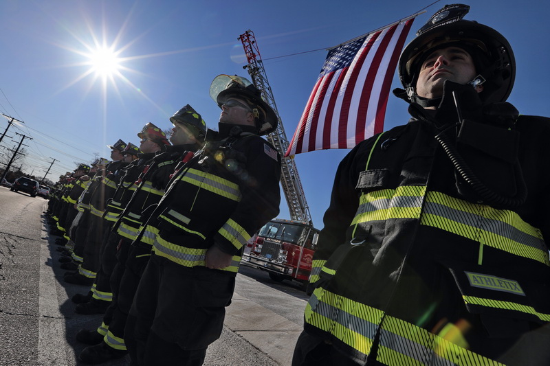 Firefighters from across two states line up outside of the Hathaway Community Home for Funerals in Somerset, MA for the wake of Somerset Fire Chief Scott Jepson.  Chief Jepson died unexpectedly.  PHOTOS PETER PEREIRA