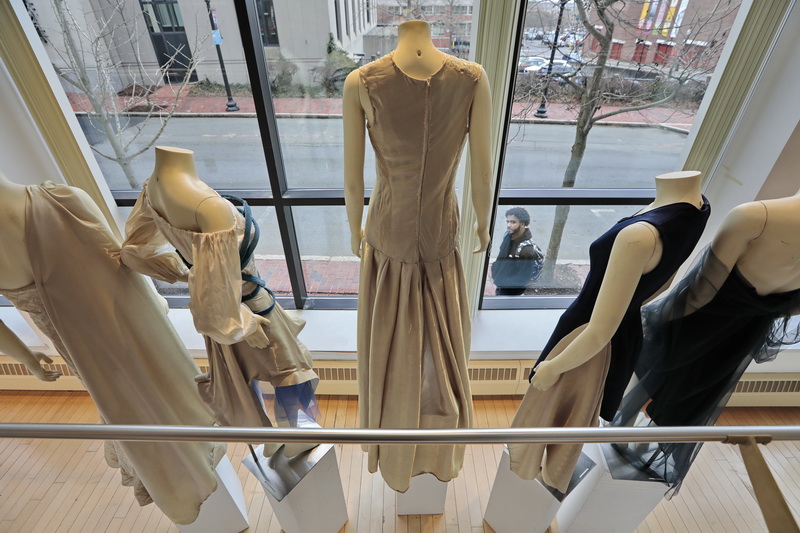 A pedestrian walking down Purchase Street, takes a look at the dresses created by seniors and on display at the UMass Dartmouth CVPA campus in downtown New Bedford, MA.  PHOTO PETER PEREIRA