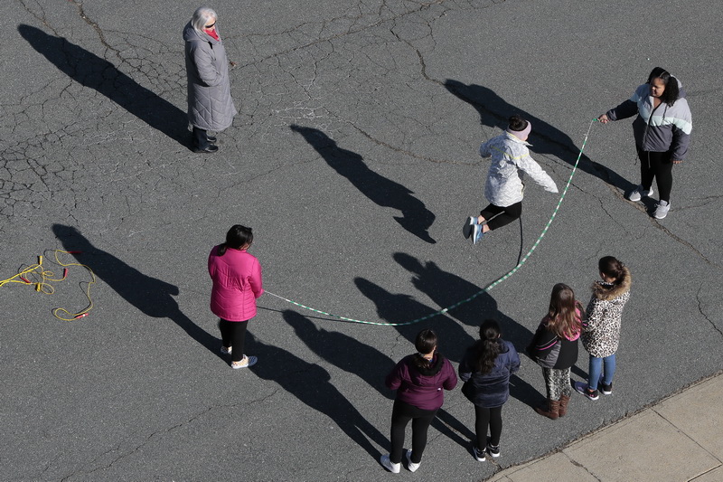 Students jump rope during recess at the Ashley School in the north end of New Bedford, MA.  PHOTO PETER PEREIRA