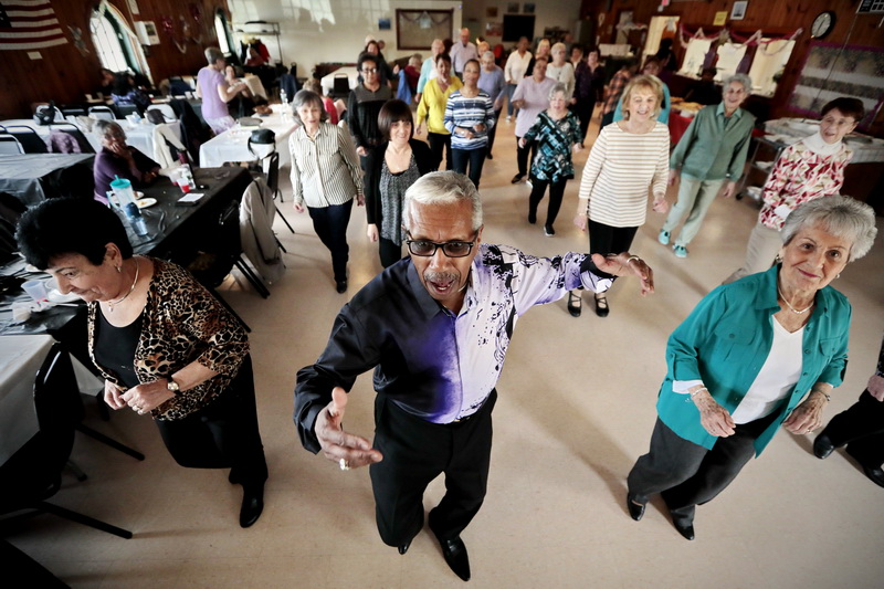 Victor Fonseca leads a session of Senior Steppers dancing at Buttonwood Senior Center in New Bedford, MA.  PHOTO PETER PEREIRA