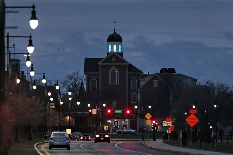 A blue light shines from the iconic cupola of the Whaling Museum in downtown New Bedford, MA 