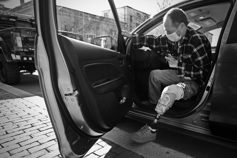 Wayne Joaquim slowly gets out of his vehicle, before making his way to New Bedford City Hall.  Mr. Joaquim, who has been dealing with diabetes since he was a boy, lost his left leg recently after it became infected and would not heal. PHOTO PETER PEREIRA