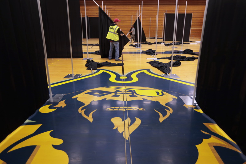 The University of Massachusetts Dartmouth mascot Corsair, is seen at the center of the basketball court, as AshBritt crews covert the UMass Dartmouth Tripp Athletic Center into a 100 bed field hospital.  PHOTO PETER PEREIRA