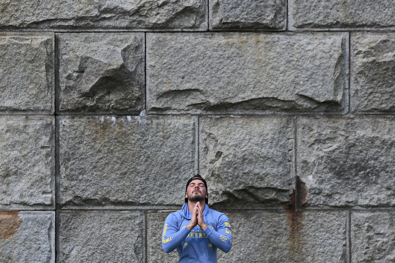 Nathan Vaughn enjoys a session of yoga in front of the colossal stone walls of Fort Rodman at Fort Taber Park in the south end of New Bedford, MA. PHOTO PETER PEREIRA