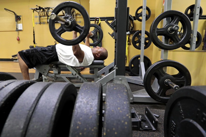 James Gomes enjoys his first session of weight training at the Anytime Fitness gym on State Road in Dartmouth, MA.  Gym's are open for the first time since the pandemic forced businesses to close in March. PHOTO PETER PEREIRA