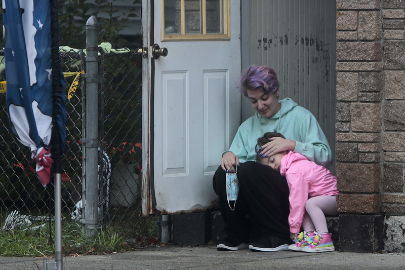 Sha-nae Laberge and her sleepy daughter, Seraphine Bettencourt, 4, wait on the doorstop to their home in New Bedford, MA for the school bus to arrive to bring Seraphine to her pre-k class.  PHOTO PETER PEREIRA