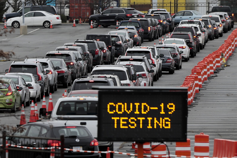 Hundreds of motorists line up at the Whale's Tooth parking lot in New Bedford, MA to be tested for COVID-19.  PHOTO PETER PEREIRA