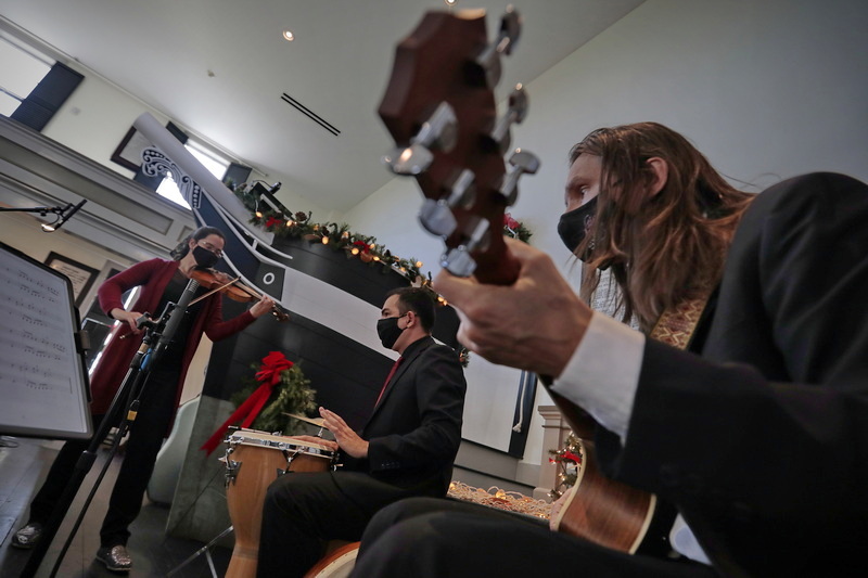 EmmaLee Holmes-Hicks, violin Piero Guimaraes, percussion, and Peter Zay, cello and guitar of the New Bedford Symphony Orchestra are seen playing inside of the Seamen's Bethel in New Bedford in preparation for the virtual Holiday Pops concert, which will be released online on December 19th at 3:30 pm.  The concert will consist of several NBSO musician groups playing holiday favorites at locations throughout downtown New Bedford. Tickets for the virtual event can be purchased online at nbsymphony.org. 