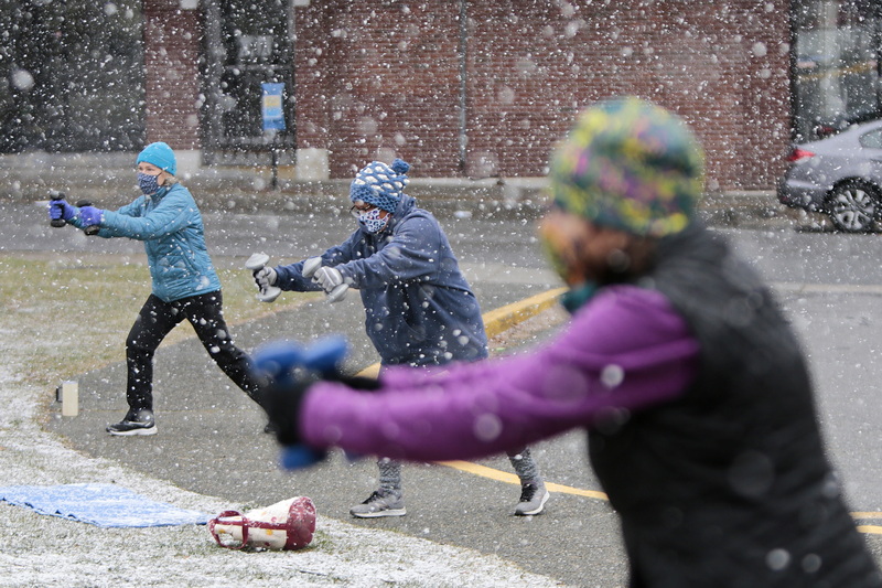 New Bedford YMCA members have taken their Tabata class workouts outside since the COVID-19 lockdown started last March, and snowfall is not enough to keep them from working out.  PHOTO PETER PEREIRA