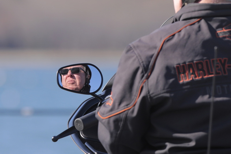 John Cornish takes a minute to stop and look out into Mattapoisett harbor, during his motorcycle ride to work in Wareham, MA. PHOTO PETER PEREIRA