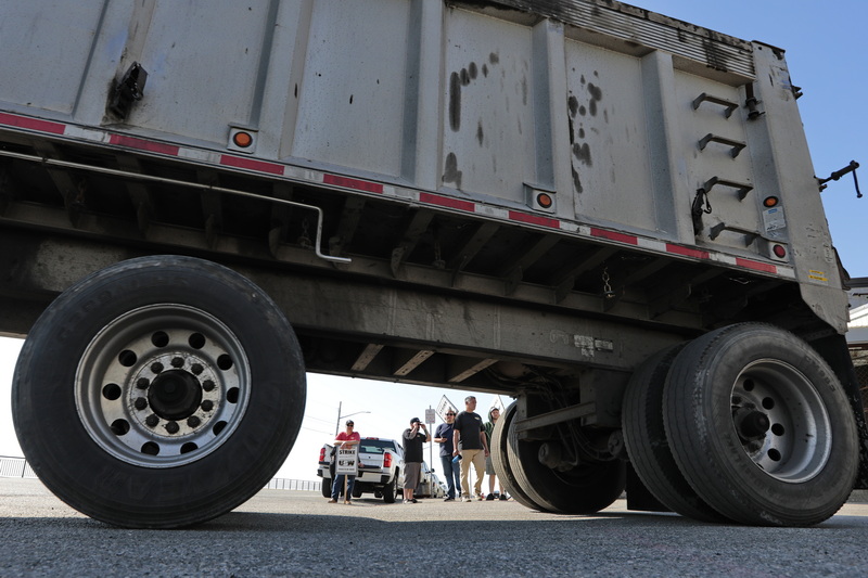 Steelworkers picket in front of ATI as a truck leaves the plant in the south end of New Bedford.  This strike is part of a national company wide strike compromised of sixty New Bedford workers along with 1,300 others in Pennsylvania, New York and Ohio. PHOTO PETER PEREIRA