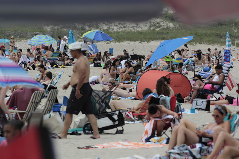 Beachgoers take advantage of the weather to enjoy a hot day at Horseneck Beach in Westport, MA.  PHOTO PETER PEREIRA