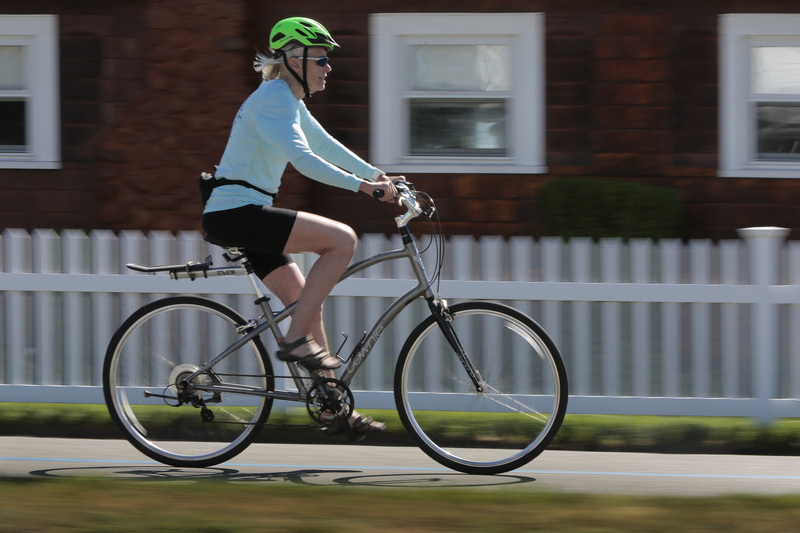 A woman rides her Townie bike on the East Rodney French Boulevard bike path in the south end of New Bedford, MA.  PHOTO PETER PEREIRA