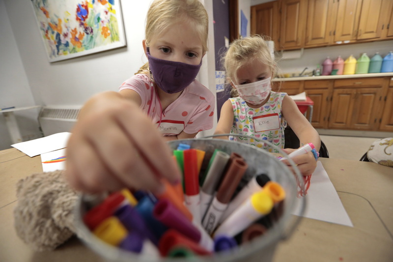 Merrill and Ellie, color using markers in art class, at the ArtStart summer 2021 program, held at the Marion Art Center in Marion, MA.  The ArtStart program includes activities in arts and crafts, theater, music, games and storytelling.  PHOTO PETER PEREIRA