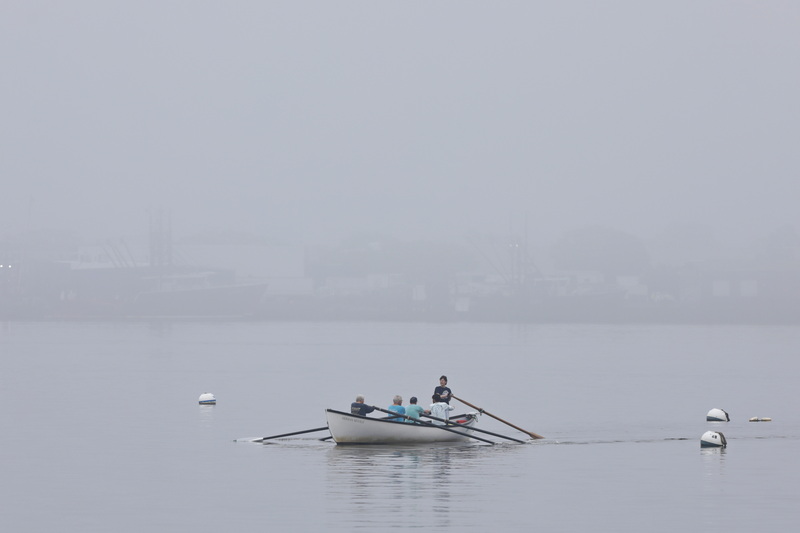 Members of the Buzzards Bay Rowing Club row across New Bedford harbor on a foggy morning.  PHOTO PETER PEREIRA