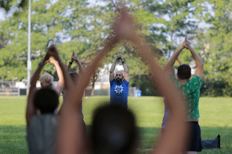 Yoga Instructor Jeff Costa, leads a class of yoga during a session of Fitness in Cushman Park in Fairhaven, MA.  Jeff's new yoga studio, Sangha New Bedford, is one of many local sponsors that support these free outdoor programs.  PHOTO PETER PEREIRA