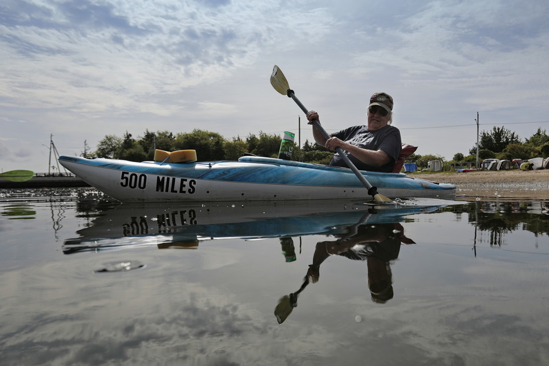 Rick Brown takes his kayak for a paddle in Padanaram harbor in Dartmouth, MA.  PHOTO PETER PEREIRA