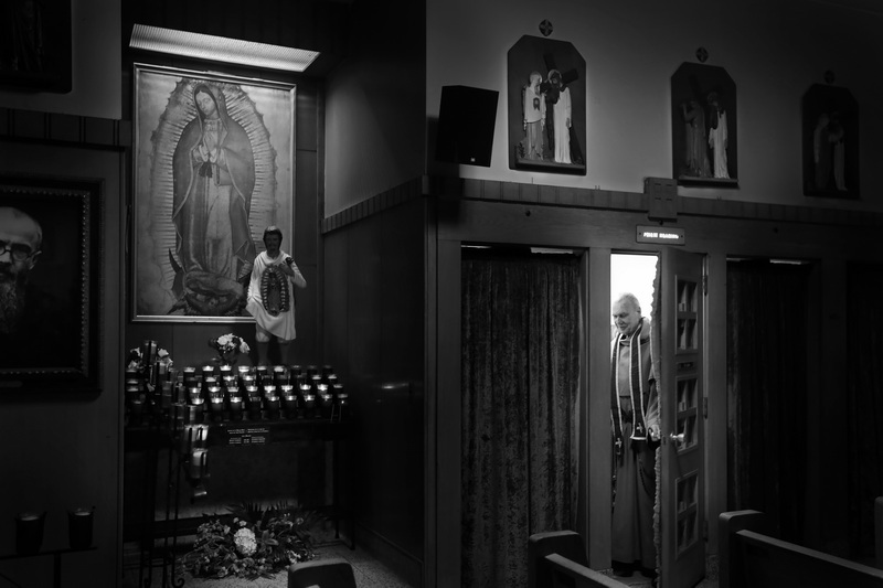 Father Andre makes his way into his confessional booth, at Our Lady's Chapel in downtown New Bedford, MA. PHOTO PETER PEREIRA