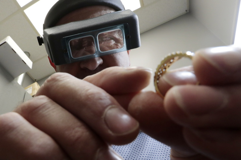 Andrew Khoury, owner, works on repairing a diamond ring in his shop at Khoury Jewelers at the Dartmouth Mall in Dartmouth, MA. PHOTO PETER PEREIRA