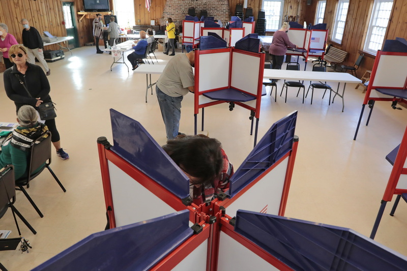 Voters cast their votes at the Buttonwood Warming House polling station in New Bedford, MA.  PHOTO PETER PEREIRA