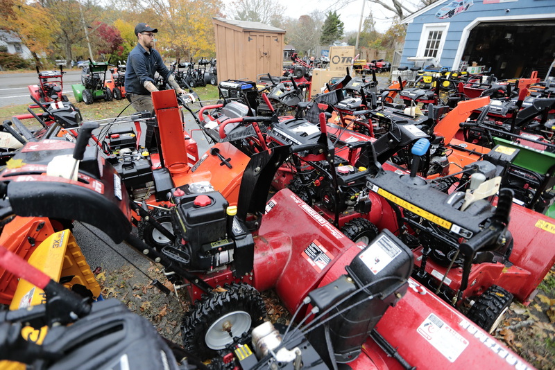 Jon Hodgkins a mechanic at Mattapoisett Power Equipment on Route 6 in Mattapoisett, pulls one of the almost fifty snow blowers that have been dropped off for servicing, as residents prepare for the winter season.  PHOTO PETER PEREIRA