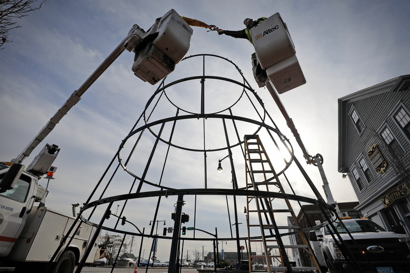 New Bedford DPI workmen install the framework for a thirty-five-foot-all Christmas tree they are installing at the intersection of Route 18 and Union Street in downtown New Bedford, MA. PHOTO PETER PEREIRA