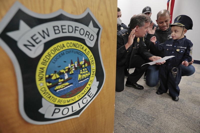 JJ Montalban, 6, who was born with congenial heart defects, is sworn in as an honorary New Bedford police officer by police chief, Paul Oliveira at a ceremony held at police headquarters on Rockdale Avenue in New Bedford.  JJ Montalban is currently in need of a heart transplant. PHOTO PETER PEREIRA