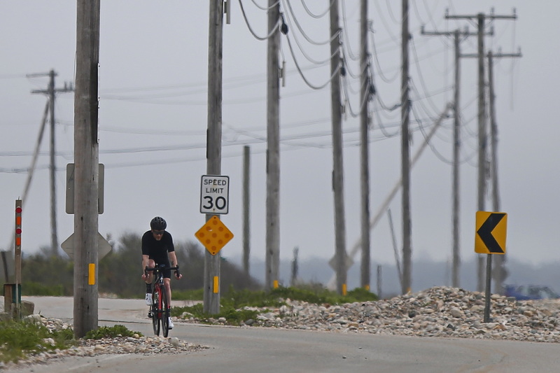 Brian Ayotte makes his way up East Beach Road in Westport, MA during a morning bike ride. PHOTO PETER PEREIRA