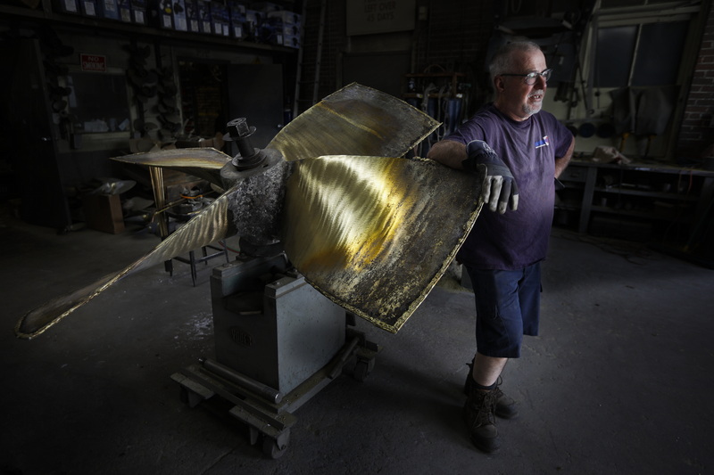 John DeMello of Scandia Propeller Service & Supply Inc. takes a break after placing the fishing boat propeller he is fixing on the working rig at the shop in Fairhaven, MA. PHOTO PETER PEREIRA