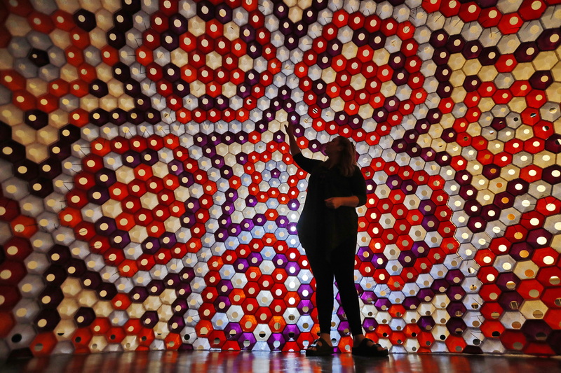 Amanda Hawkins, DATMA Program Manager, takes a closer look at the Star Lounge by Rael San Fratello, installed in the UMass Dartmouth CVPA gallery in downtown New Bedford.  The domed structure was created using 3D-printed bio-plastic and is one of the largest to date.  PHOTO PETER PEREIRA