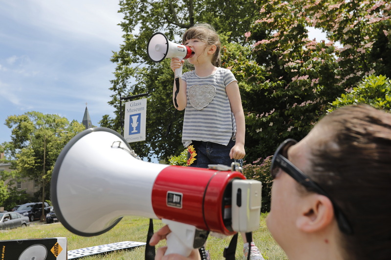 Lisa White and her daughter Della White, 6, lead participants in chant as people protest ruling overturning Roe v Wade at a rally held at intersection of Union Street and County Street in New Bedford, MA.  PHOTO PETER PEREIRA