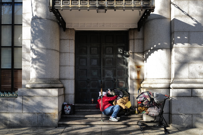 Amanda is not sure how to help as her boyfriend Richard is not feeling well as they sit on the steps of the former Merchants Bank in downtown New Bedford, MA. Amanda has been homeless for the last ten years and is dealing with addiction. PHOTO PETER PEREIRA