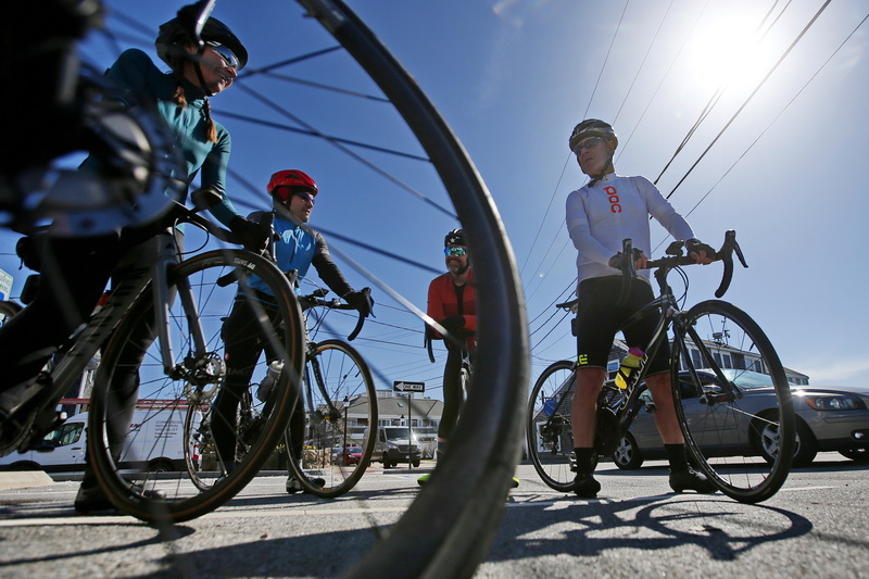 Cyclists decide on what route to ride as they wait for the Padanaram bridge to open in Dartmouth, MA. Unfortunately the bridge never opened after encountering a mechanical issue. PHOTO PETER PEREIRA