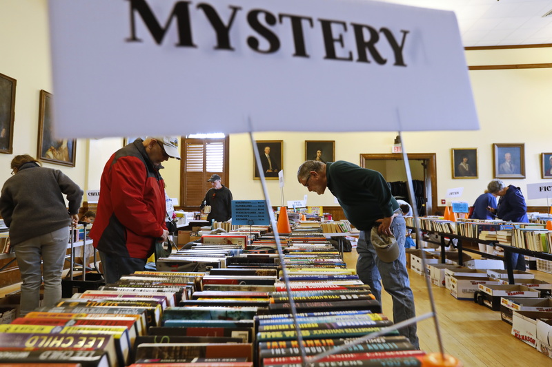 People browse through the books for sale at the annual Friends of Elizabeth Taber Library book sale held at the Marion Music Hall.  The book sale will happen on May 10th and May 11th. PHOTO PETER PEREIRA