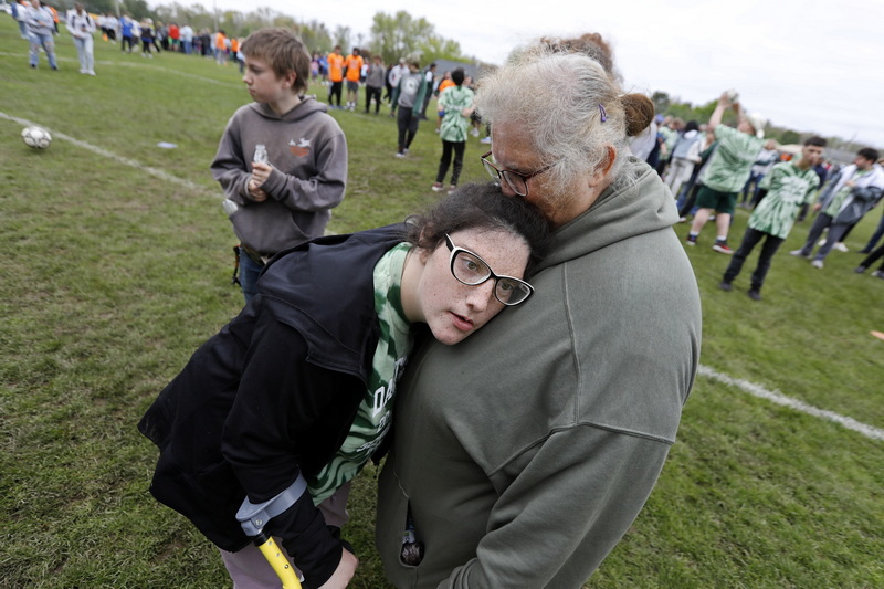 Wanda Pittsley kisses her daughter Amanda Pittsley after she kicked a soccer ball during the Special Olympics held at the DYSA field in Dartmouth, MA.