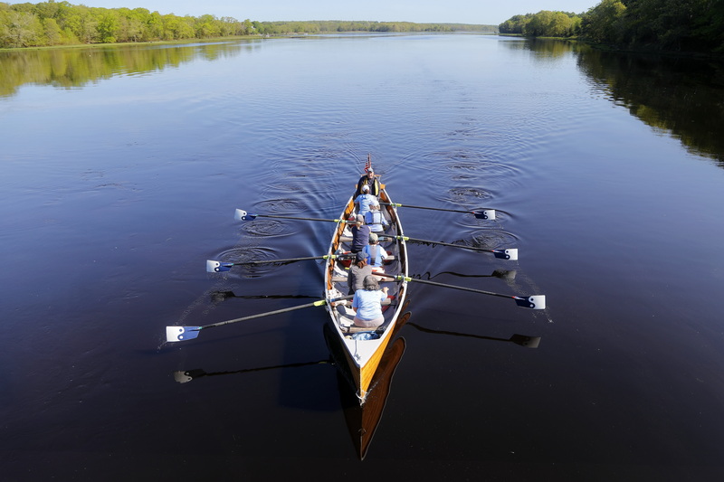 Members of Dharma Voyage rowing club make their way up the Westport River in Westport, MA.   PHOTO PETER PEREIRA