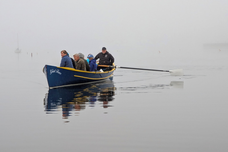 Members of the Buzzards Bay Rowing Club make their way across New Bedford harbor on a foggy morning.  PHOTO PETER PEREIRA