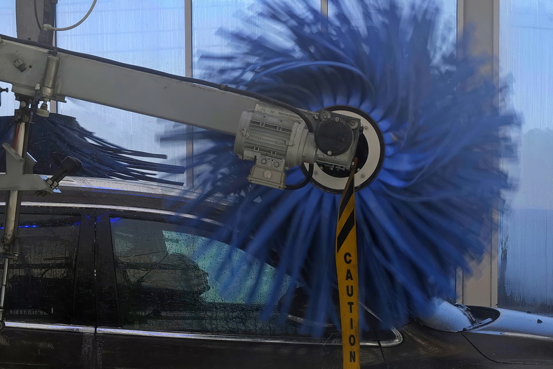 A woman is seen through the windows of her vehicle as she makes her way through the automated car wash at Regency Car Wash on Route 6 in Wareham, MA. PHOTO PETER PEREIRA