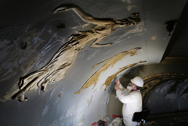 Grigor Mita removes the damaged plaster on one of the muses lining the iconic ceiling of the Zeiterion Theater in New Bedford, MA currently undergoing a multi-million dollar restoration. PHOTO PETER PEREIRA